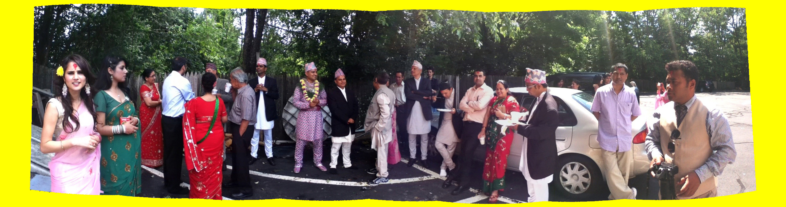 a photograph of people at a wedding socializing in a parking lot